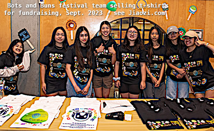 volunteers at table showcasing and selling bots and buns t-shirts for fund raising